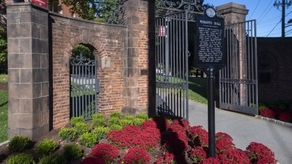 Gate with red flowers.