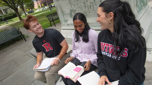 Students sitting together outside