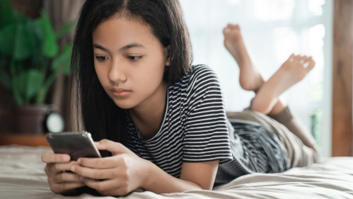 Teen on phone.