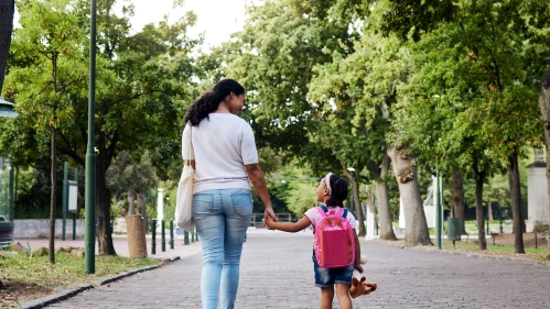 mom and daughter walking outside