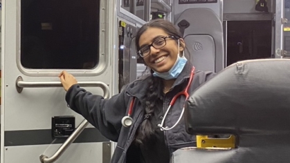 student smiling in EMT