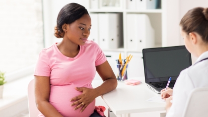 Pregnant person at doctor's office.