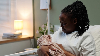 mother holding baby