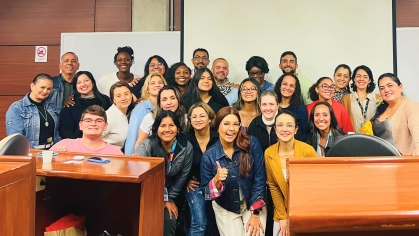 students and instructors posing for photo in classroom in colombia