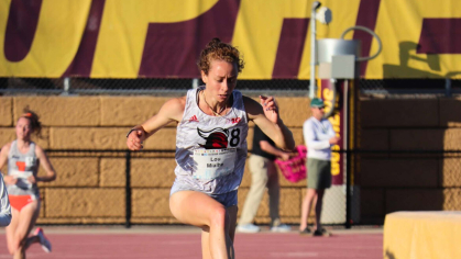 Rutgers NCAA student athlete competing in hurdle race