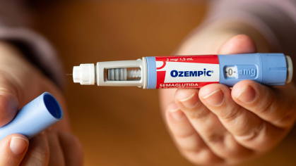 a hand holding an Ozempic treatment