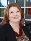 Headshot of Laura Warne.