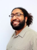 Headshot of J. Khan.