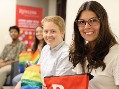 Four students looking at camera and smiling.