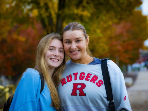 Two students smiling for the camera.