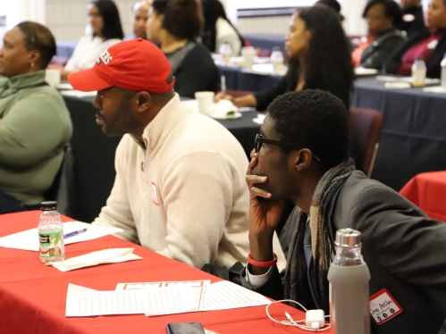 Students sitting at tables.