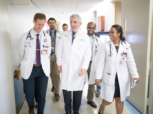 Physicians walking down a hallway