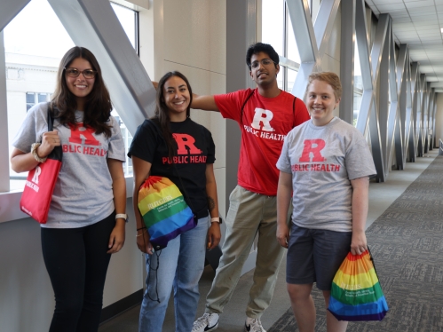 Students standing together with SPH swag