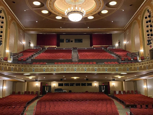 an empty theatre with chairs