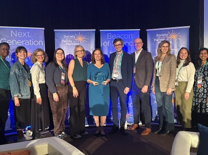 group photo at conference with awardee Laura Lindberg