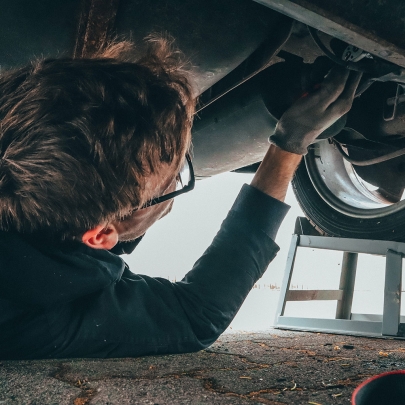 Mechanic working under an automobile.