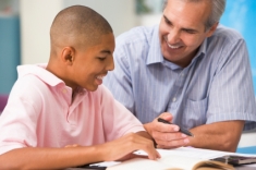 Student and teacher going over a lesson.