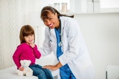 Doctor working with child patient.