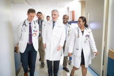 Physicians walking down a hallway