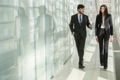 Business student walking down hallway