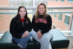 Students sitting together on a bench