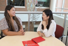 Students sitting and speaking to each other