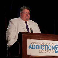 Philip McCabe speaking at conference