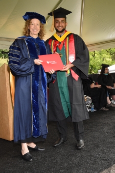 student receiving diploma