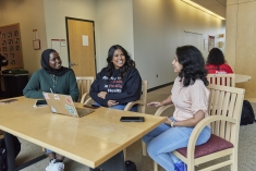 student speaking with each other outside of class